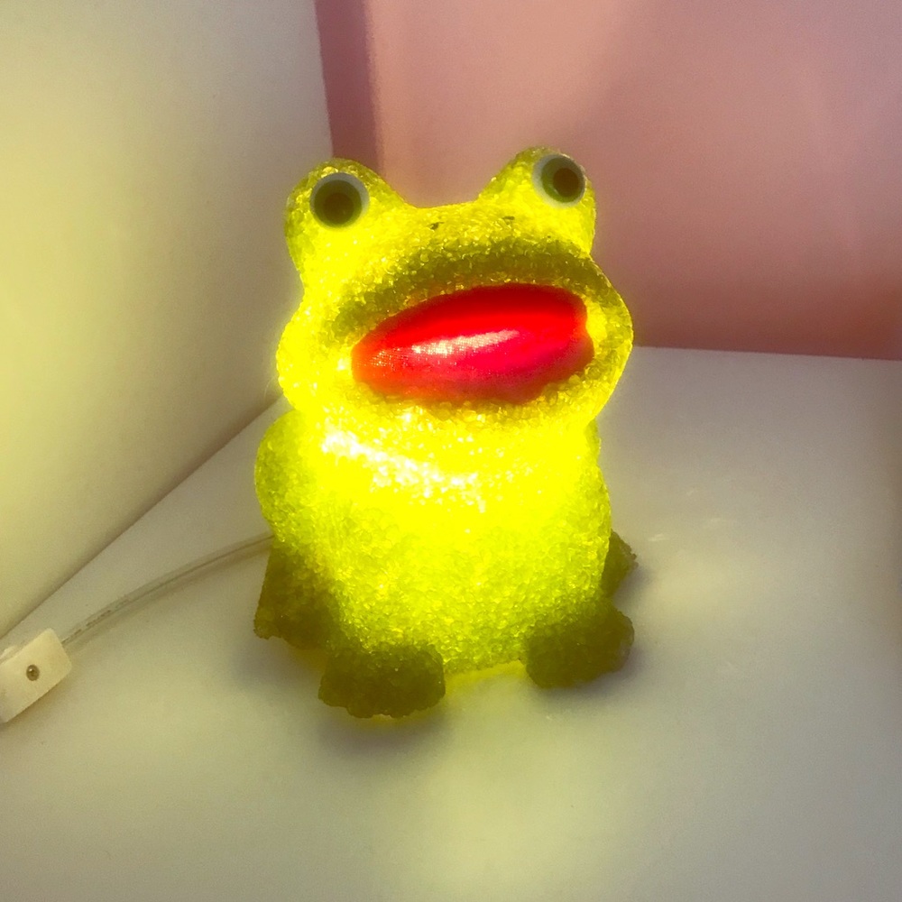 Green frog plug in night light